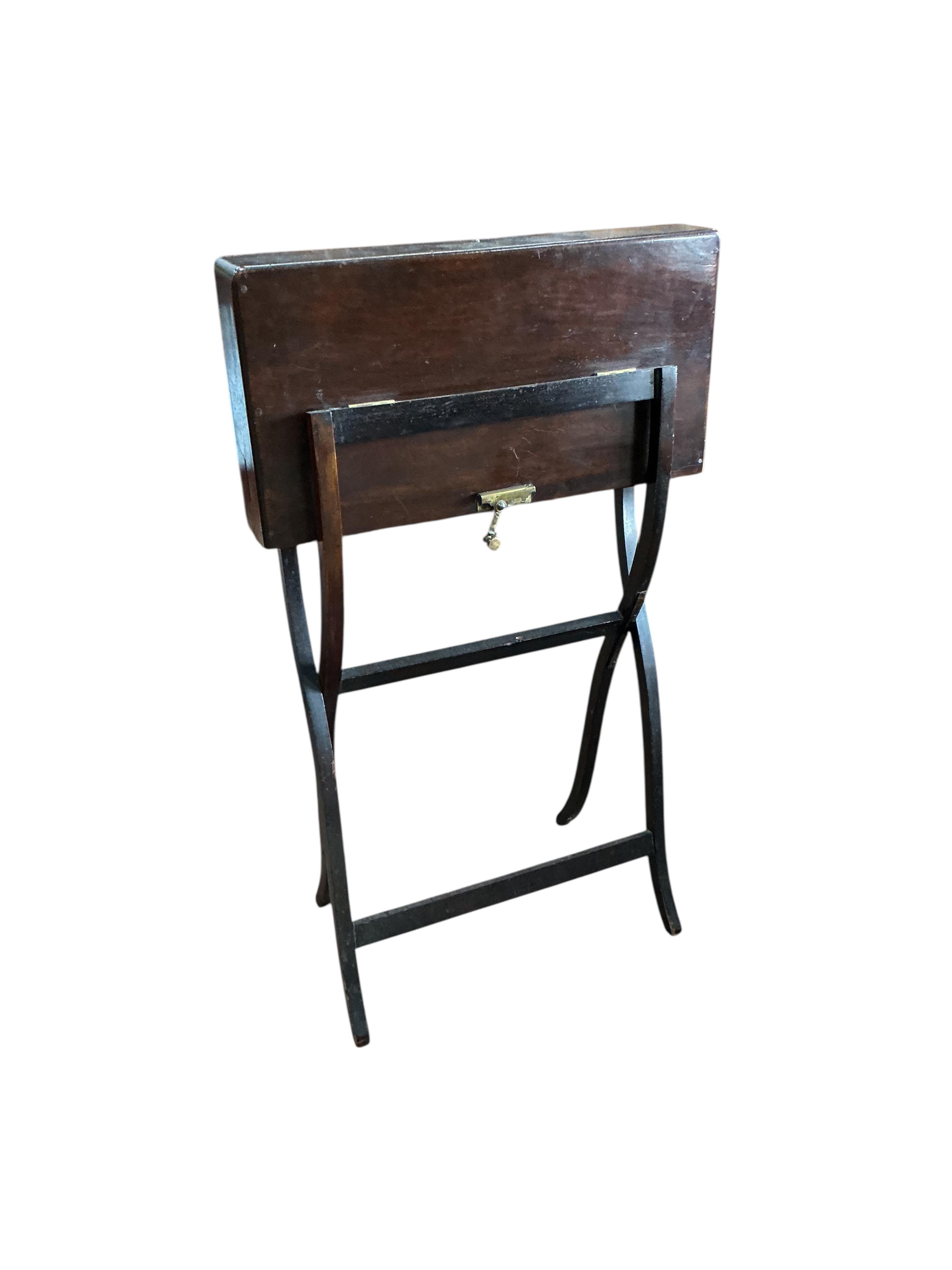 An early 20th century rectangular mahogany folding travelling writing table, width 56cm, height 92cm